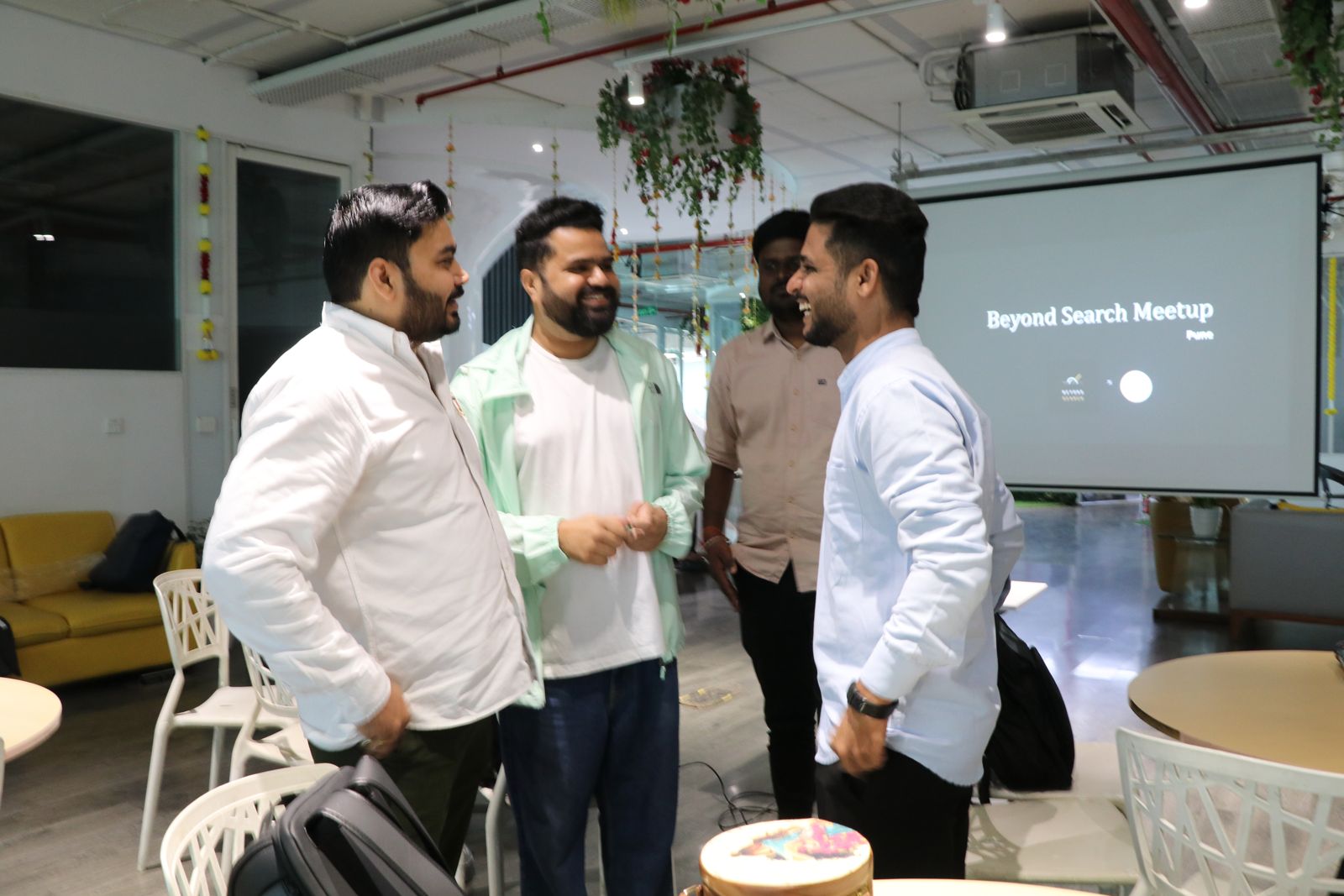 Attendees in conversation between sessions in Pune