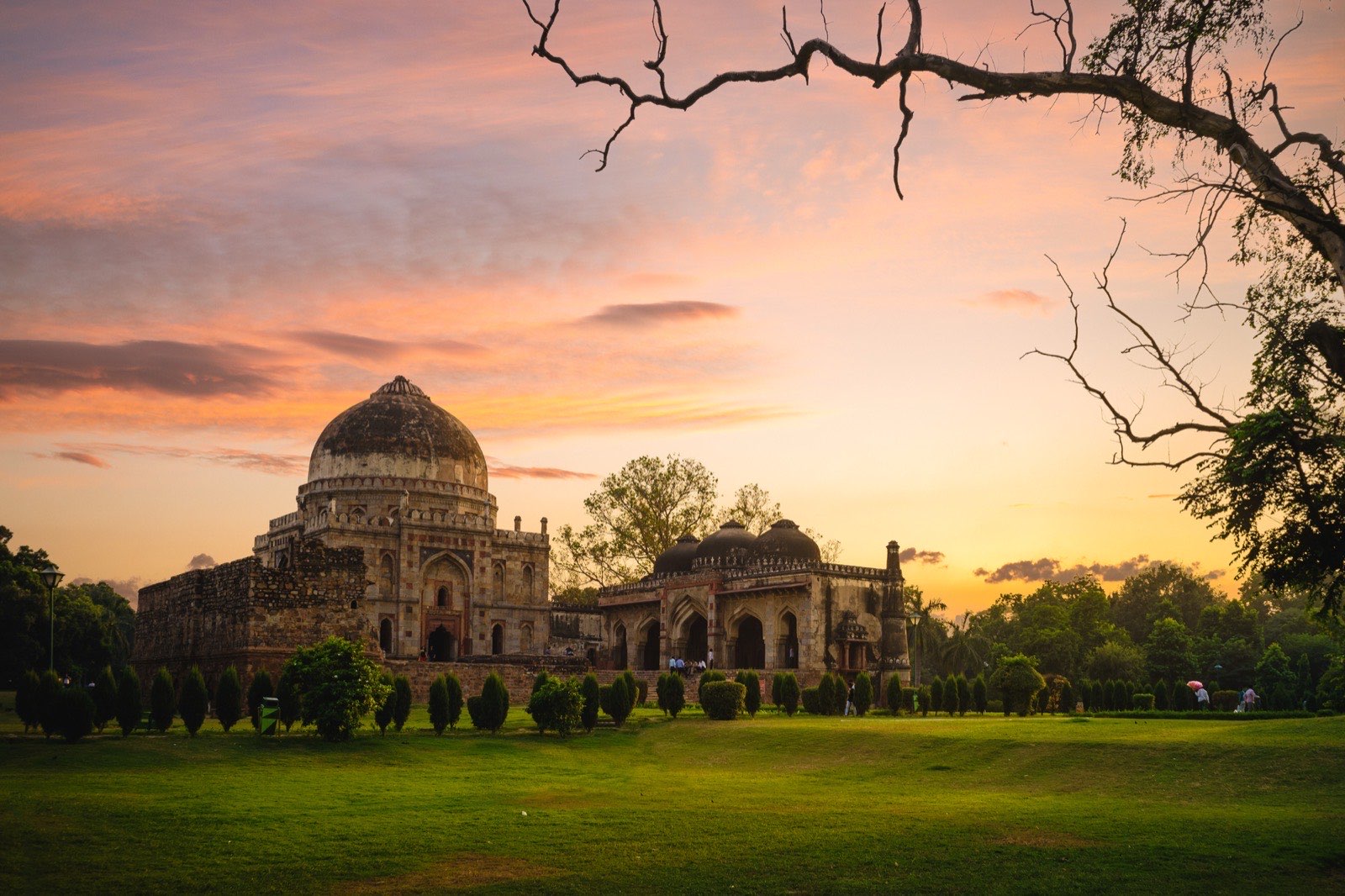 Visitors walking through Lodhi Garden in Delhi