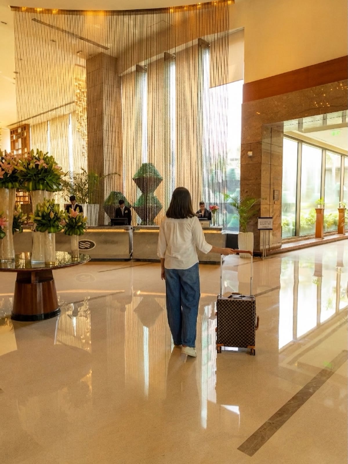 A guest arriving in the lobby at Crowne Plaza, Gurgaon